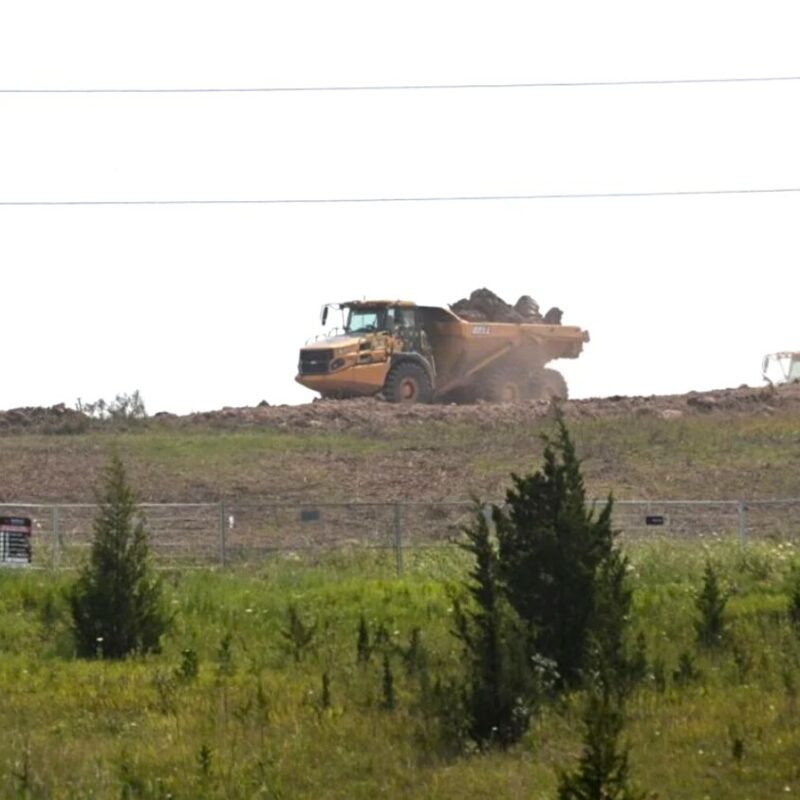 An articulated hauler moves soil across the future site of Asahi Kasei Corp.’s $1.56-billion, 185,800-square-metre electric battery separator manufacturing facility in Port Colborne.