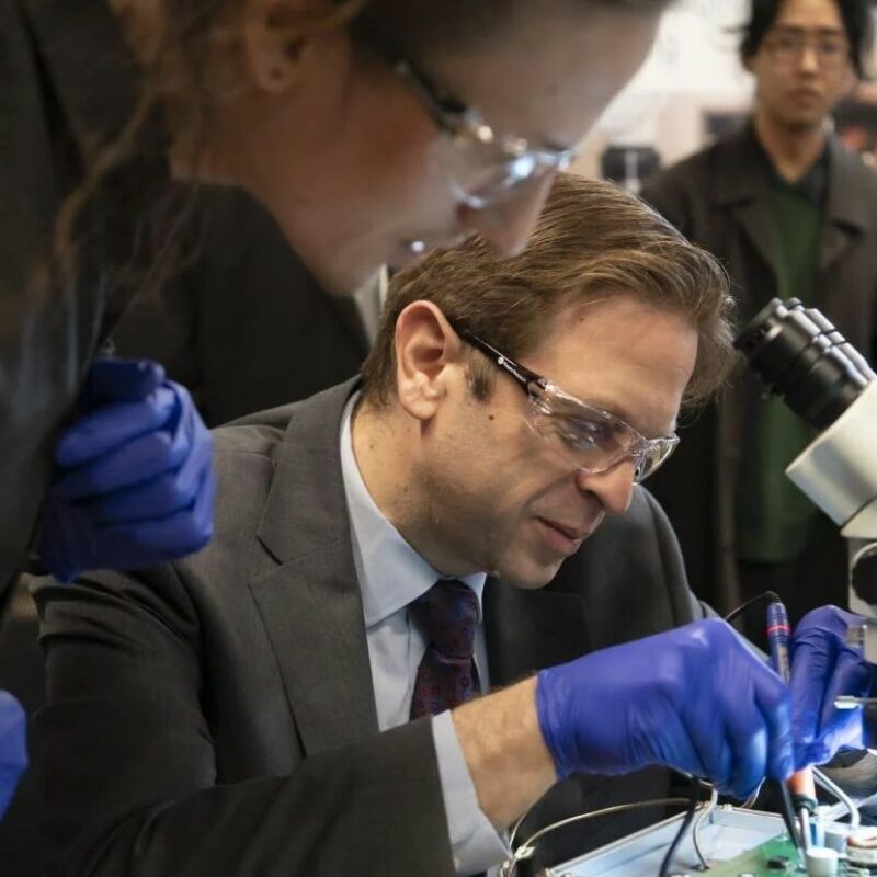 St. Catharines MP Chris Bittle gets a hands-on demonstration at a soldering station from Niagara College research assistant Kainaan Riordan, an electronics engineering technology student, at the Walker Advanced Manufacturing Innovation Centre.