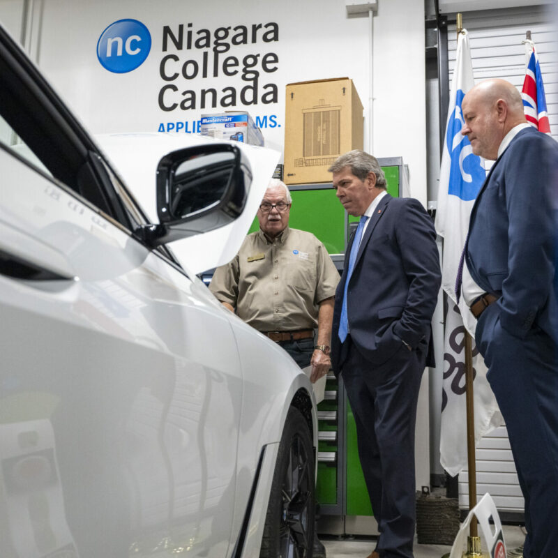 From L to R: Coordinator of NC’s Motive Power program, Wayne Toth, MP Vance Badawey, and NC President Sean Kennedy in the Green Automotive Technology Lab at the Welland Campus.